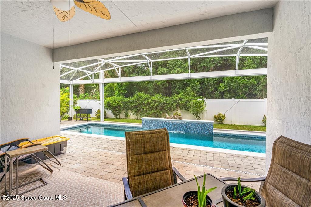 Undisclosed Address Vero Beach, FL 32966 - Photo 9 of 36 a living room filled with furniture and a large window