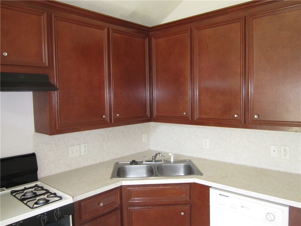 306 Fairway Drive, Unit A Bryan, TX 77801 - Photo 3 of 11 a kitchen with cabinets and window