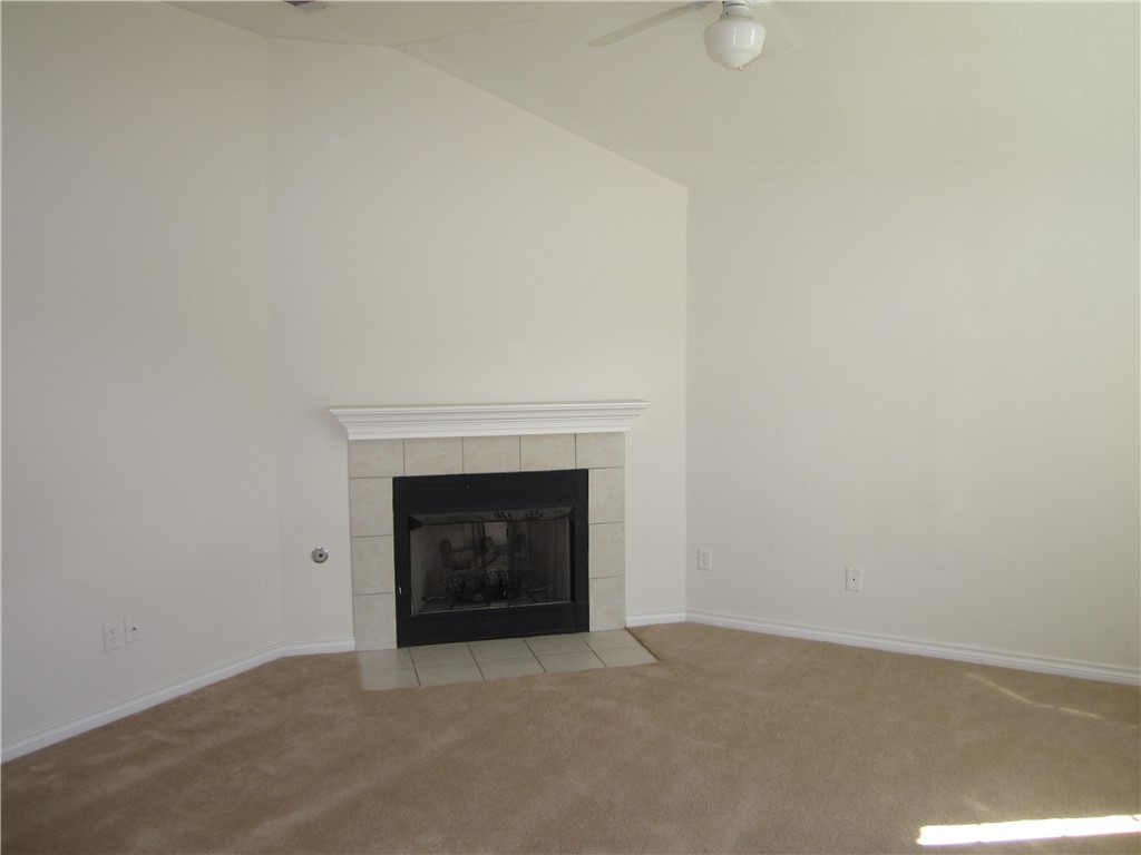 306 Fairway Drive, Unit A Bryan, TX 77801 - Photo 4 of 11 a view of an empty room with a fireplace
