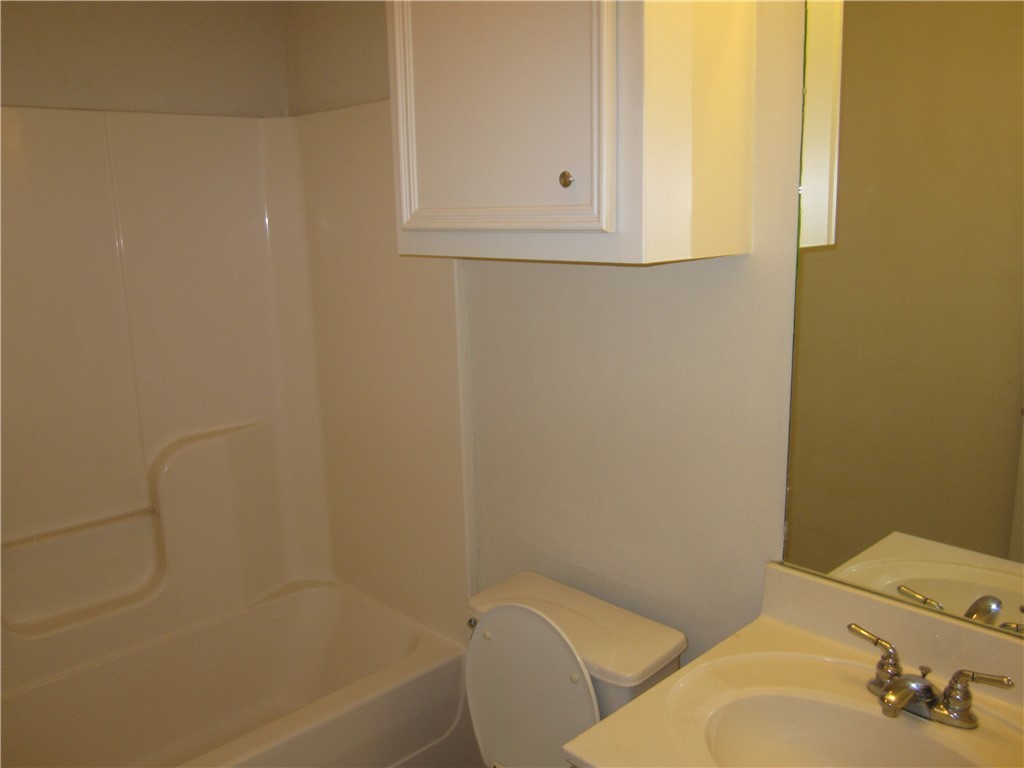 306 Fairway Drive, Unit A Bryan, TX 77801 - Photo 6 of 11 a bathroom with a bathtub