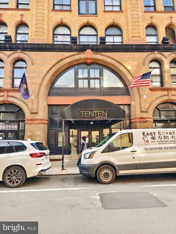 a view of a car parked in front of a building