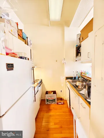 a kitchen with stainless steel appliances granite countertop a stove and a refrigerator
