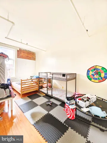 a bedroom with furniture and a window