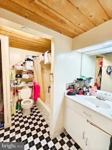 a room with a white cabinets and window