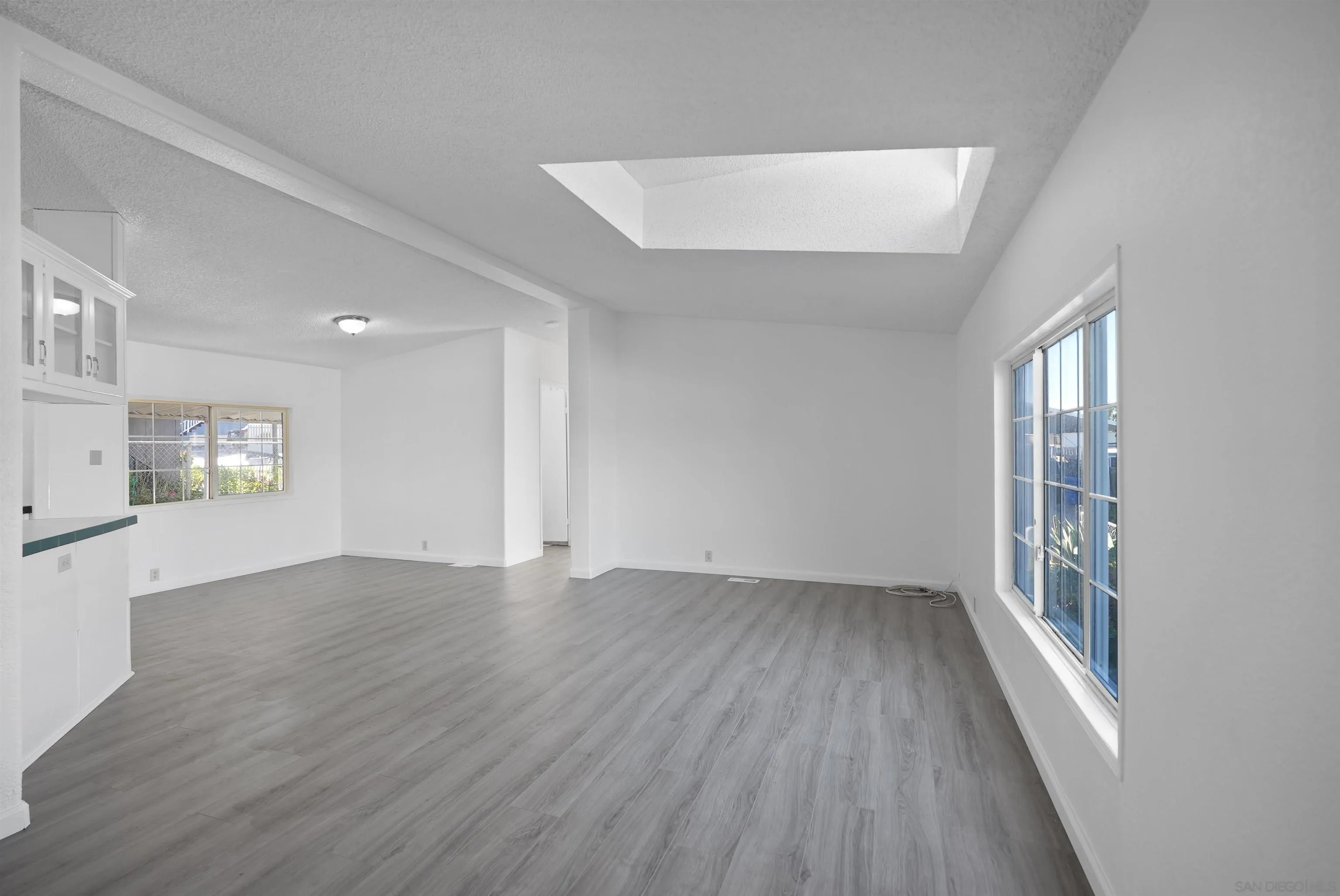 1455 Alturas Road, Unit SPC 18 Fallbrook, CA 92028 - Photo 13 of 50 wooden floor in an empty room with a window