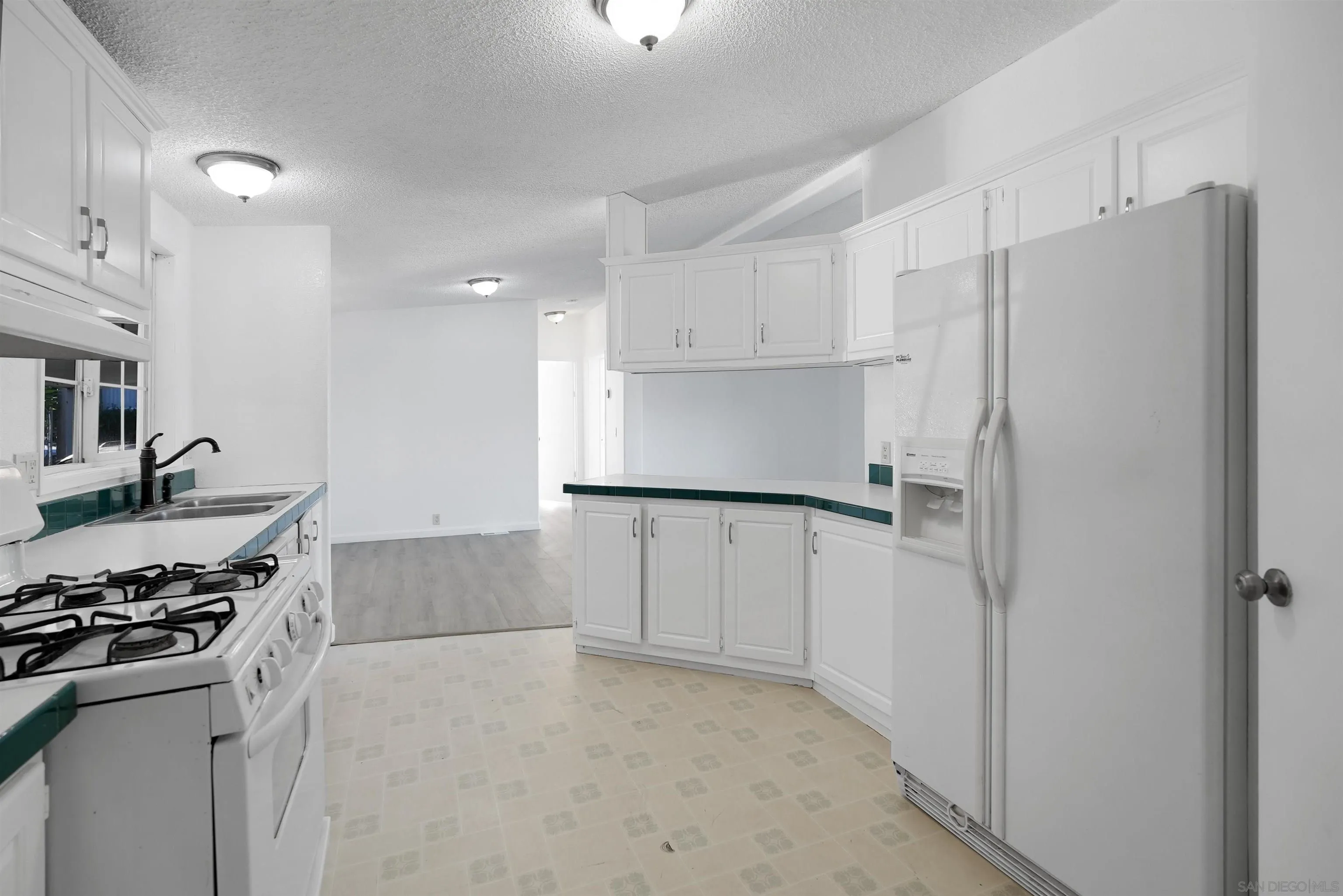 1455 Alturas Road, Unit SPC 18 Fallbrook, CA 92028 - Photo 18 of 50 a kitchen with stainless steel appliances a refrigerator stove and sink