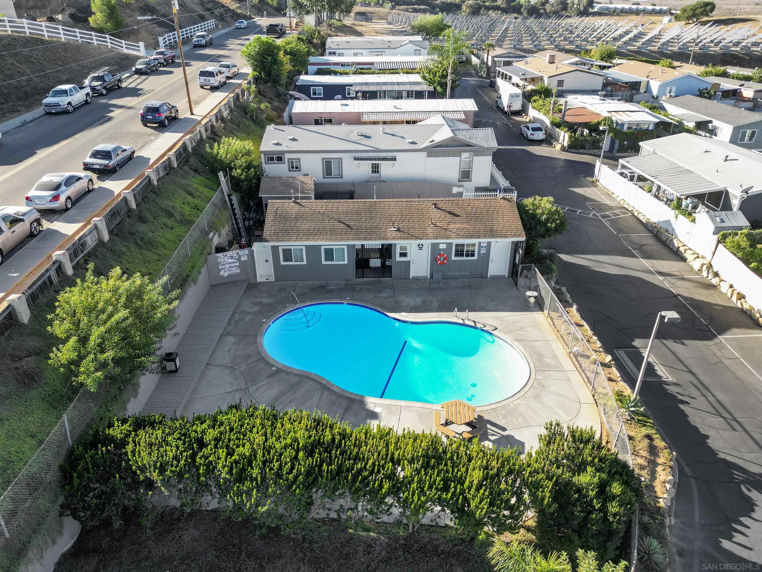 1455 Alturas Road, Unit SPC 18 Fallbrook, CA 92028 - Photo 39 of 50 an aerial view of a swimming pool with a yard and outdoor seating