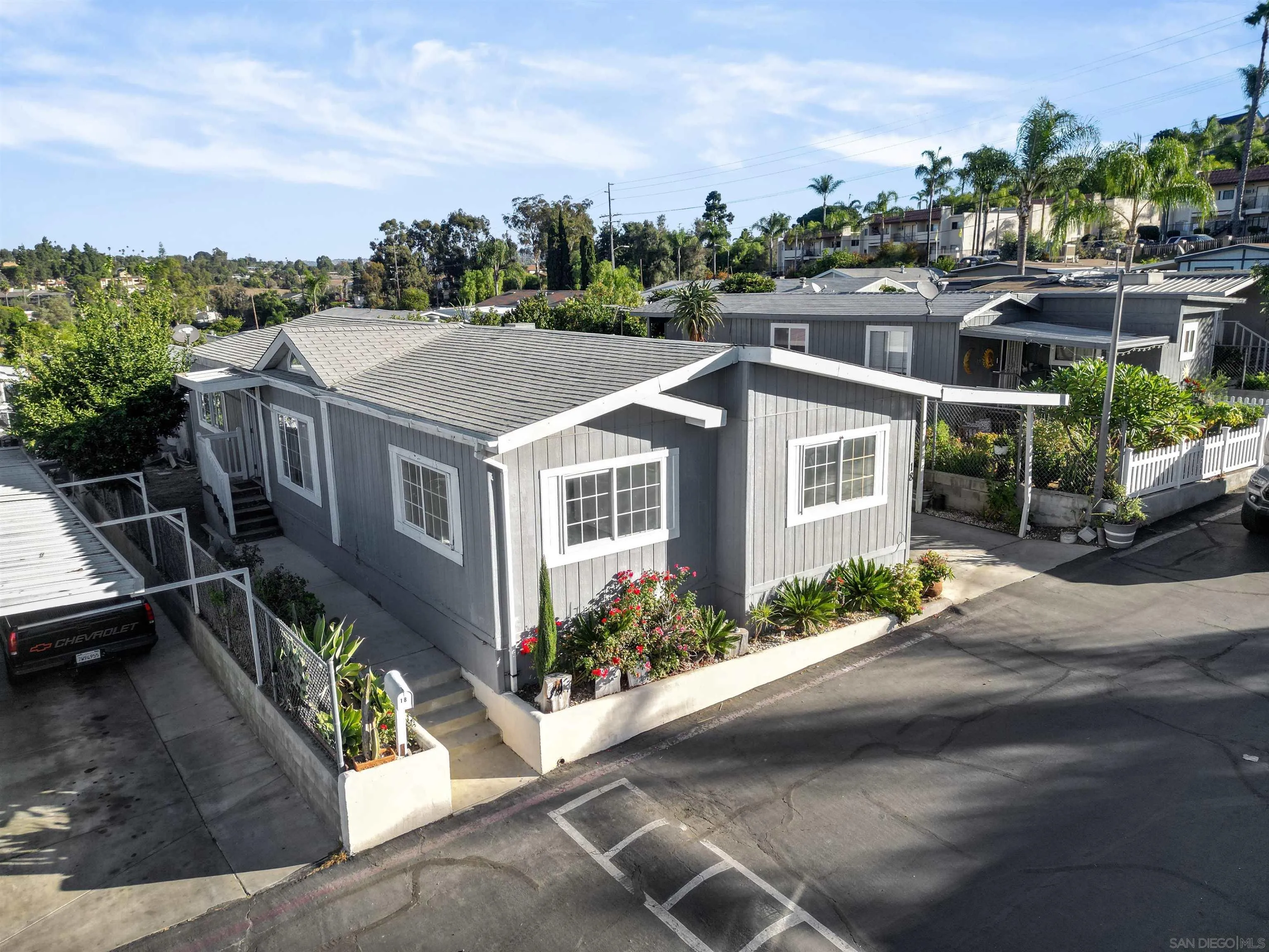 1455 Alturas Road, Unit SPC 18 Fallbrook, CA 92028 - Photo 43 of 50 a aerial view of a house with a yard and potted plants