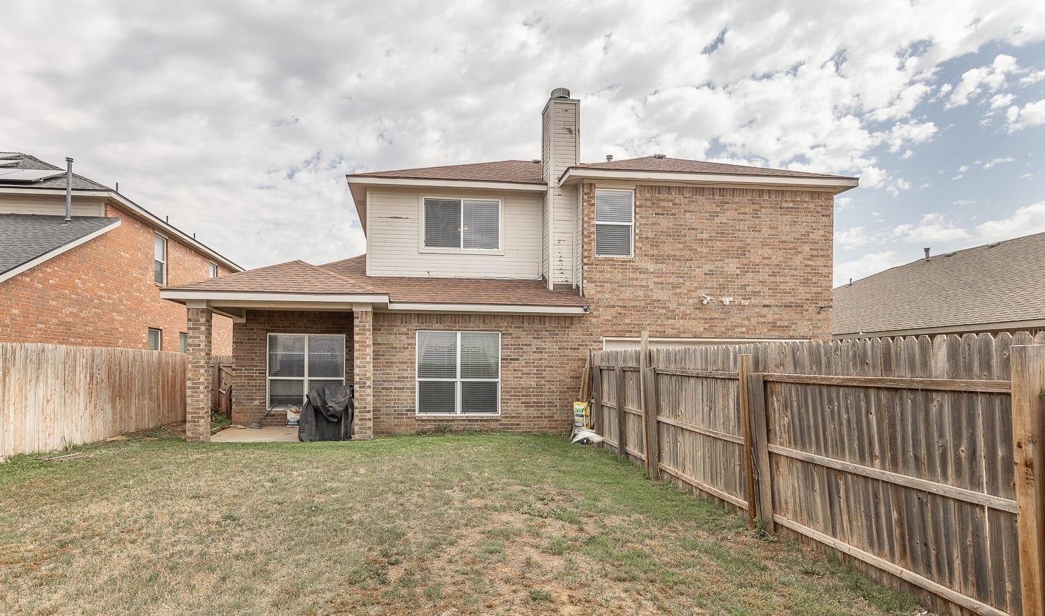5211 Harvard Street Lubbock, TX 79416 - Photo 29 of 31 a front view of a house with a yard