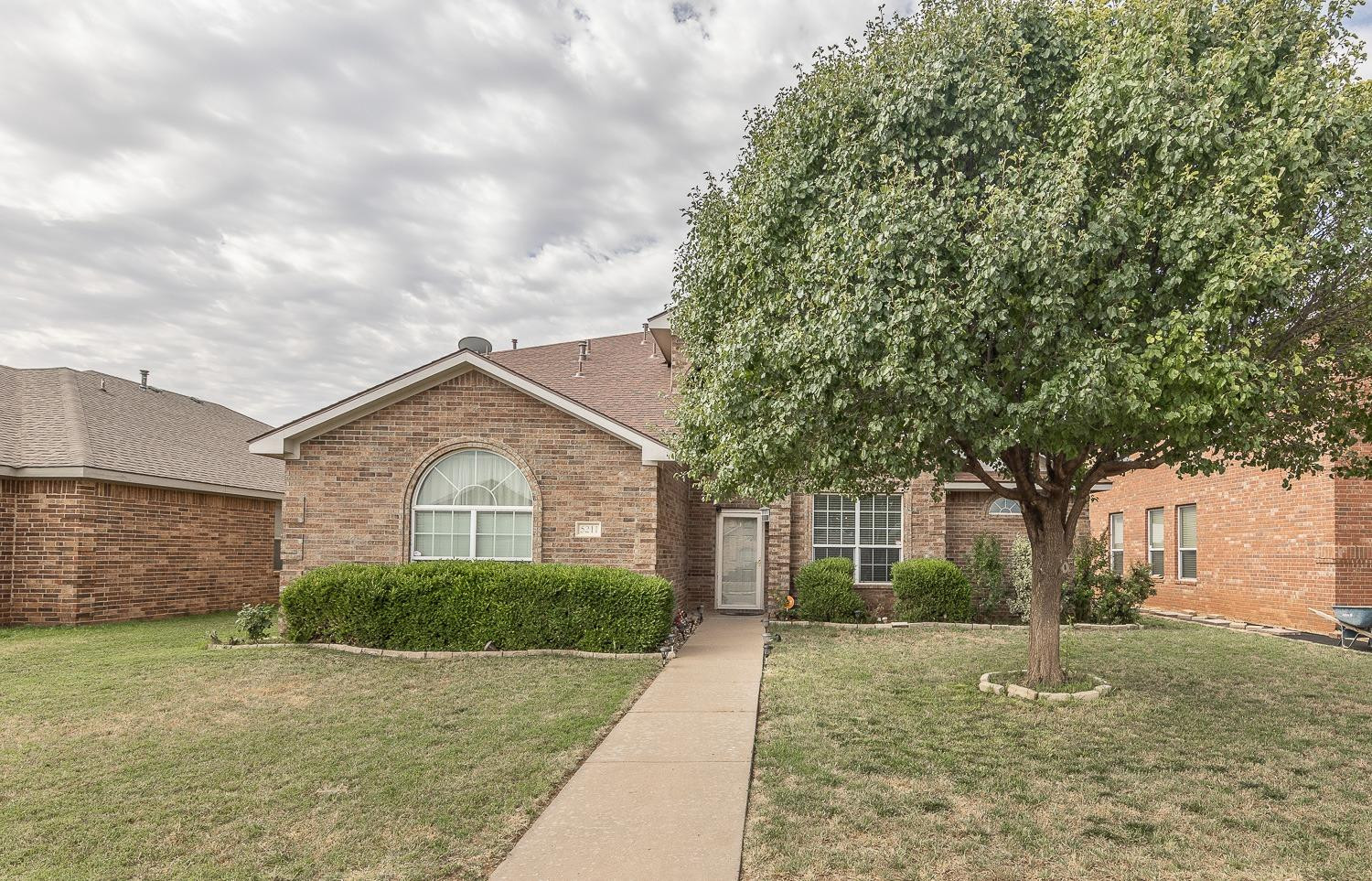 5211 Harvard Street Lubbock, TX 79416 - Photo 30 of 31 a front view of a house with garden