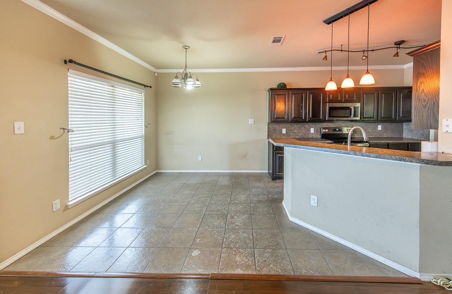 5211 Harvard Street Lubbock, TX 79416 - Photo 7 of 31 a view of a kitchen with a sink and cabinets