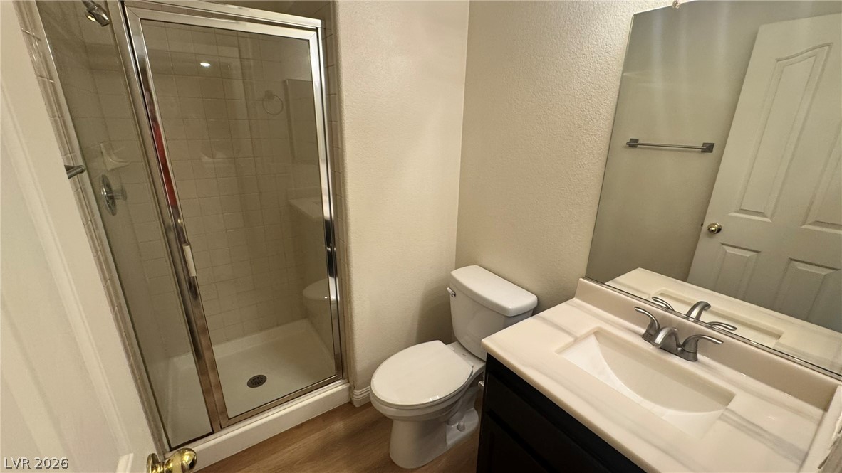9716 Ridge Creek Place Las Vegas, NV 89134 - Photo 13 of 28 This bright bathroom features a spacious shower and a modern vanity, offering comfort and style.