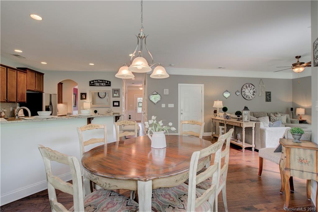 1200 Ridgehaven Road Waxhaw, NC 28173 - Photo 14 of 47 a view of a dining room with furniture and wooden floor