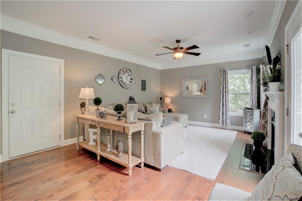 1200 Ridgehaven Road Waxhaw, NC 28173 - Photo 18 of 47 a view of a bedroom with furniture window and wooden floor