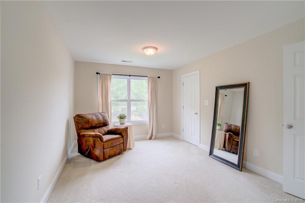 1200 Ridgehaven Road Waxhaw, NC 28173 - Photo 26 of 47 a living room with furniture and a window