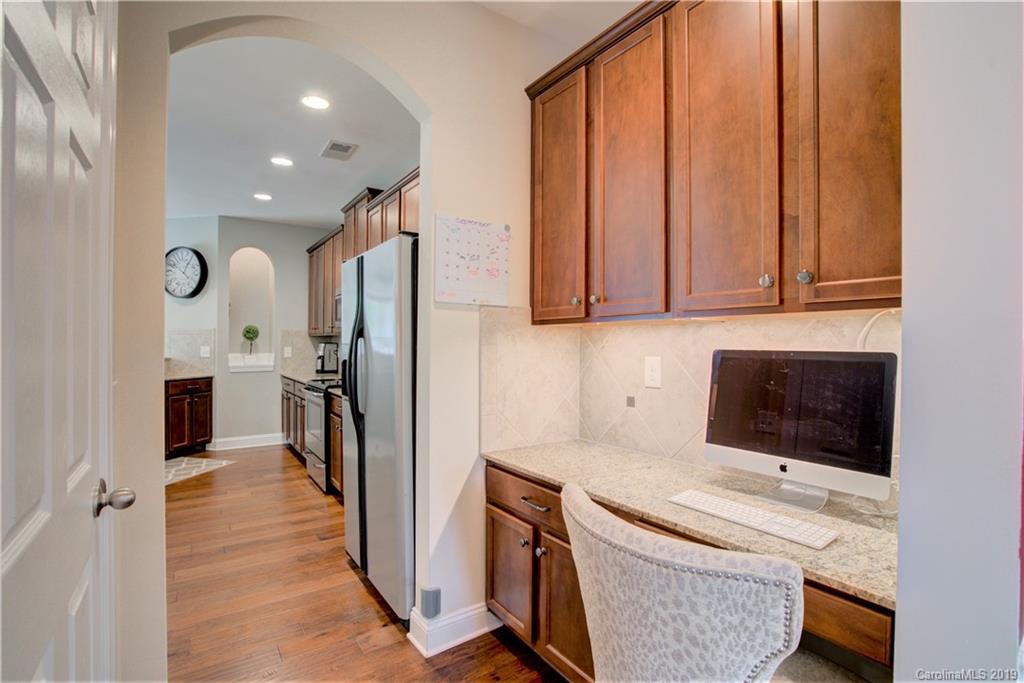 1200 Ridgehaven Road Waxhaw, NC 28173 - Photo 7 of 47 a kitchen with stainless steel appliances granite countertop a refrigerator sink and stove