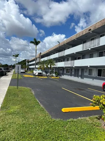 a view of a swimming pool with a yard