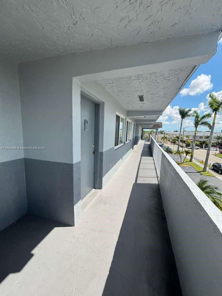 11005 Southwest 1st Street, Unit 302 Sweetwater, FL 33174 - Photo 2 of 9 a view of a living room and entryway