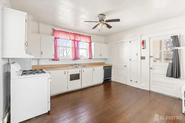 a view of a kitchen with electric appliances
