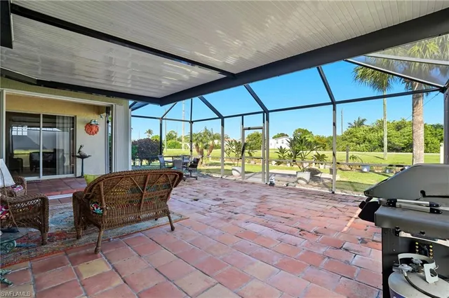 a patio with yard and outdoor seating
