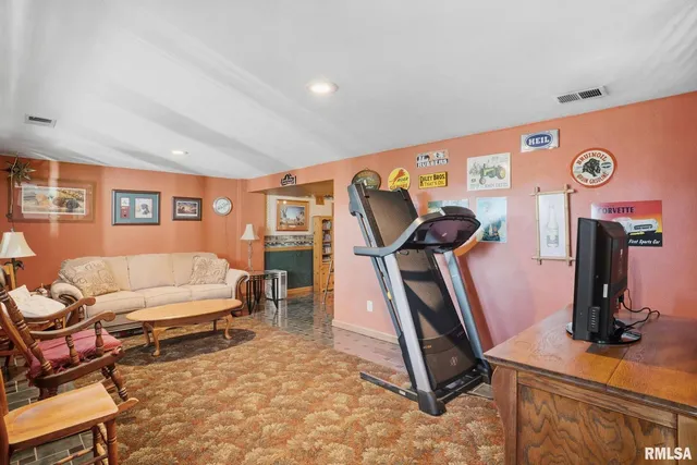 a view of a kitchen with a dining table and chairs
