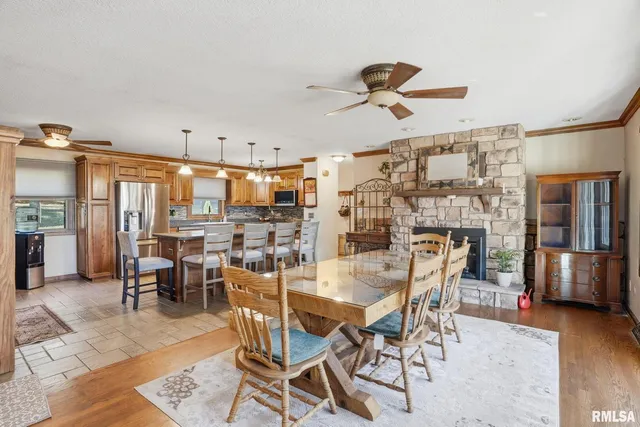 a dining room with furniture and wooden floor