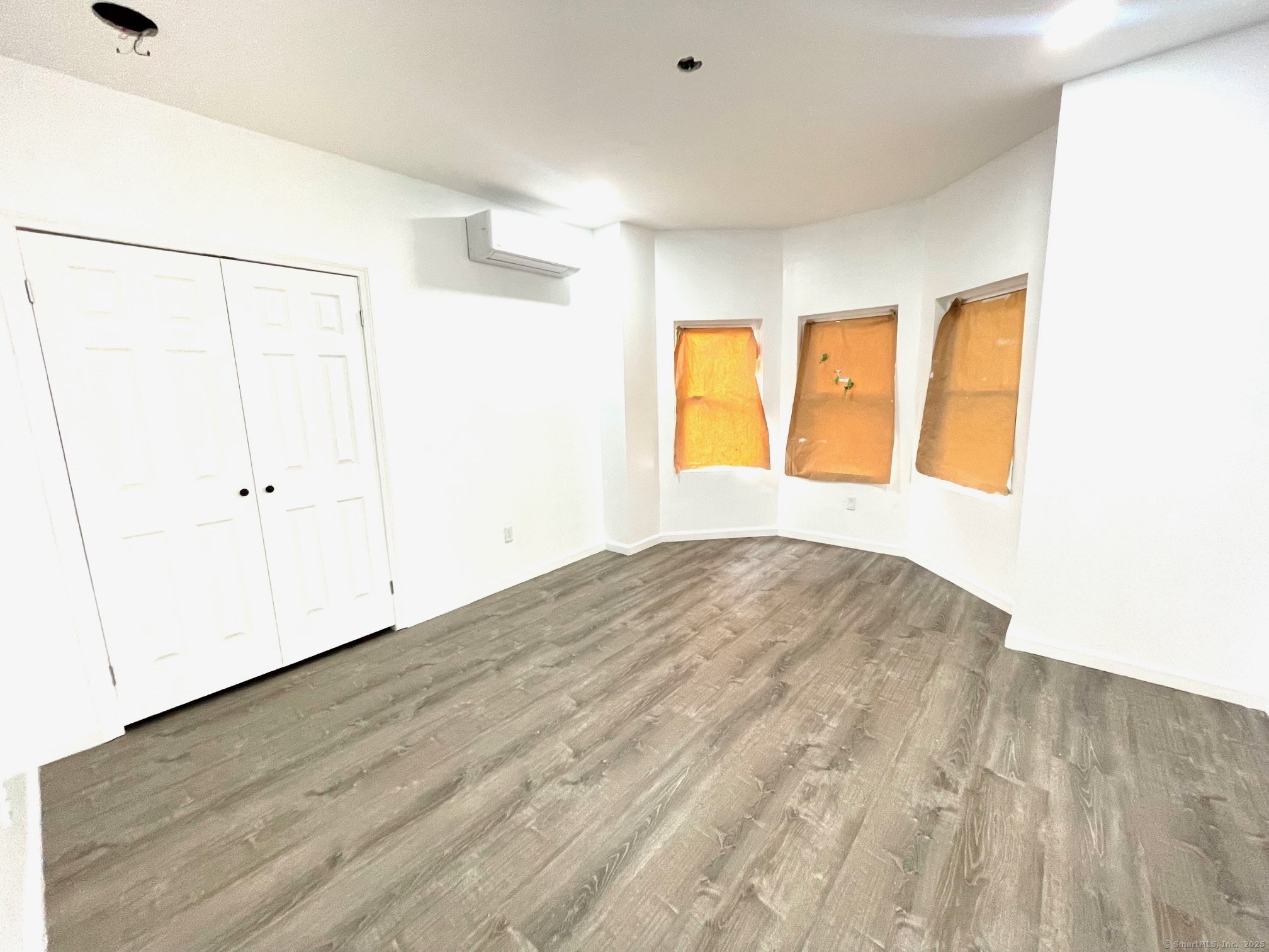 32 Lester Street Ansonia, CT 06401 - Photo 7 of 11 a view of empty room with wooden floor