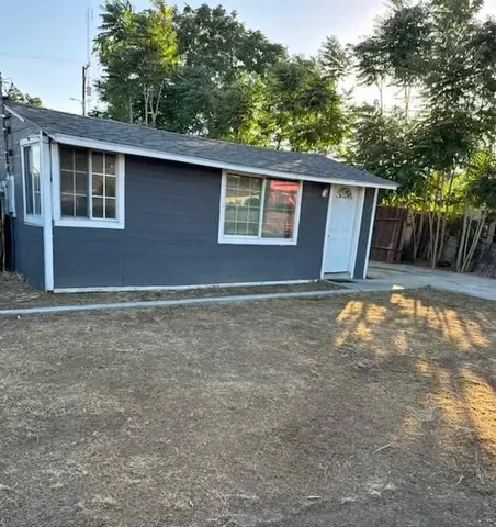 a backyard of a house with lots of green space