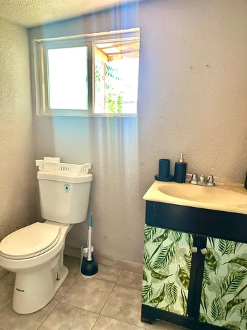 a bathroom with a toilet and a sink