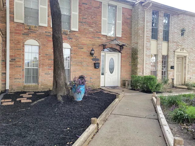 a front view of a house with outdoor space