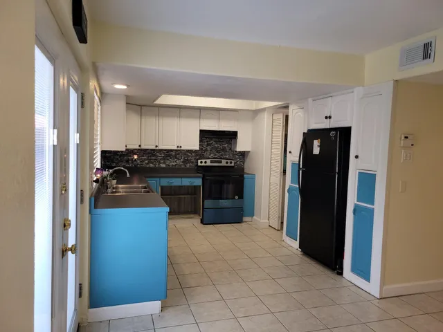 a bathroom with a sink toilet and a mirror