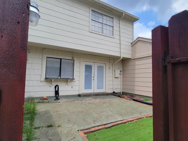 a view of a door and a window