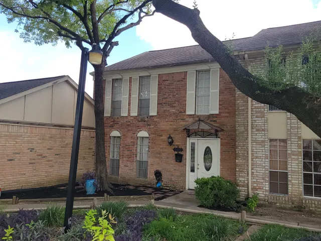 a front view of a house with stairs