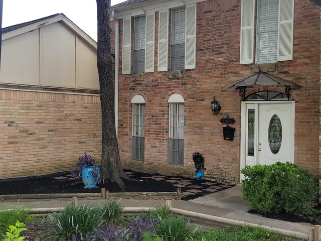a front view of a house with a fence
