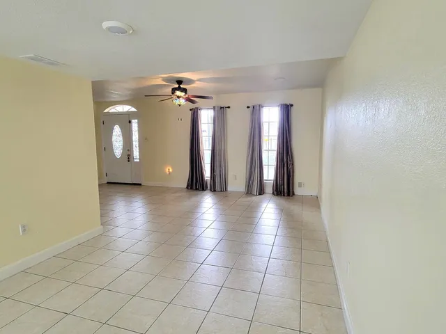 a view of a hallway with a chandelier