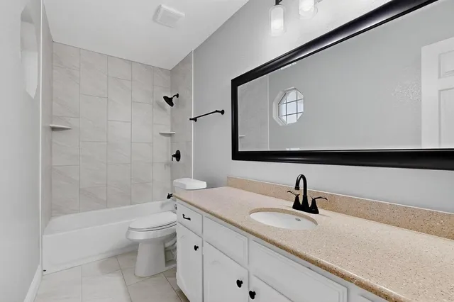 a bathroom with a toilet a sink and a bathtub