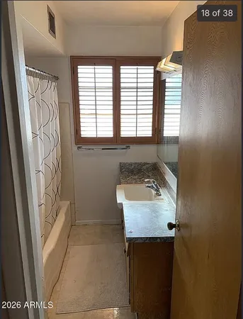a view of a storage and utility room with washer and dryer
