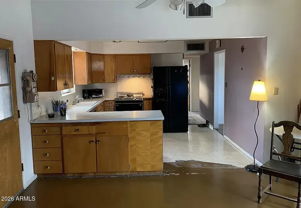 a kitchen with a refrigerator stove and a sink