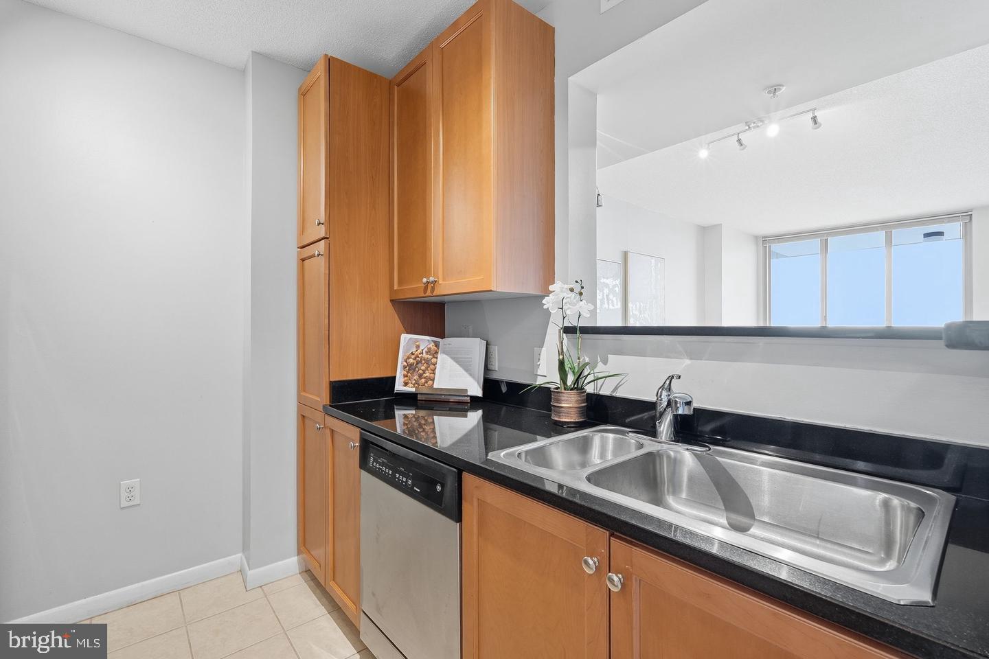 851 North Glebe Road, Unit 1914 Arlington, VA 22203 - Photo 12 of 38 a kitchen with stainless steel appliances granite countertop a sink and a granite counter tops