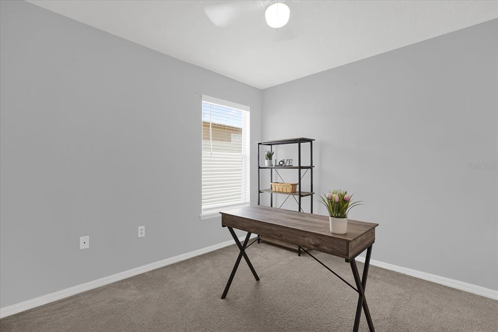 1453 Royal Ridge Drive Davenport, FL 33896 - Photo 15 of 32 a workspace room with furniture and a window
