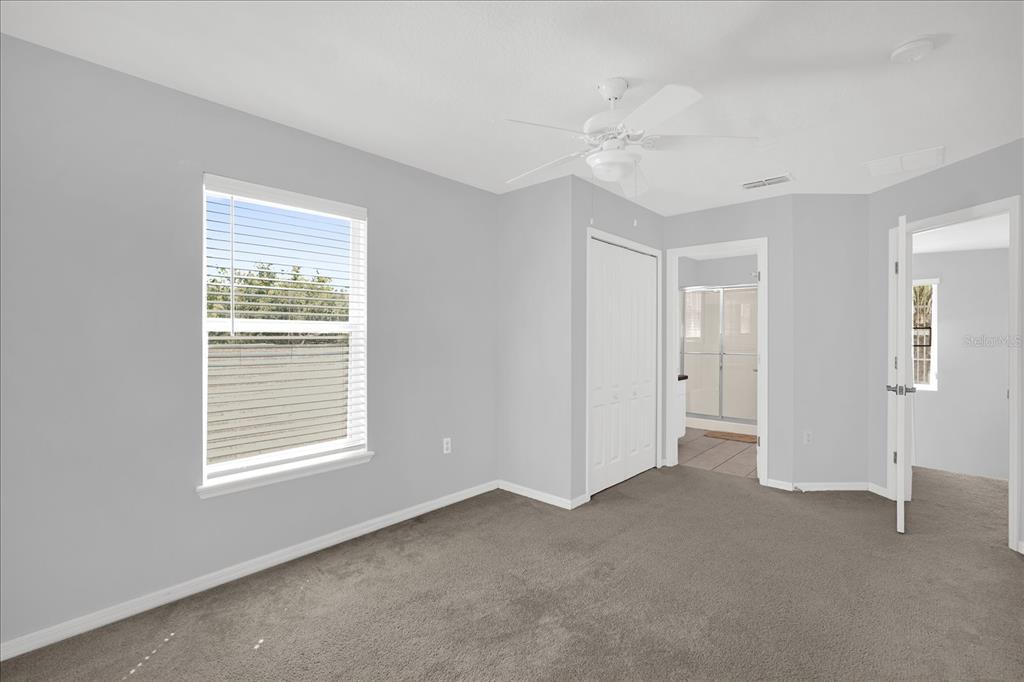 1453 Royal Ridge Drive Davenport, FL 33896 - Photo 21 of 32 a view of an empty room with a window