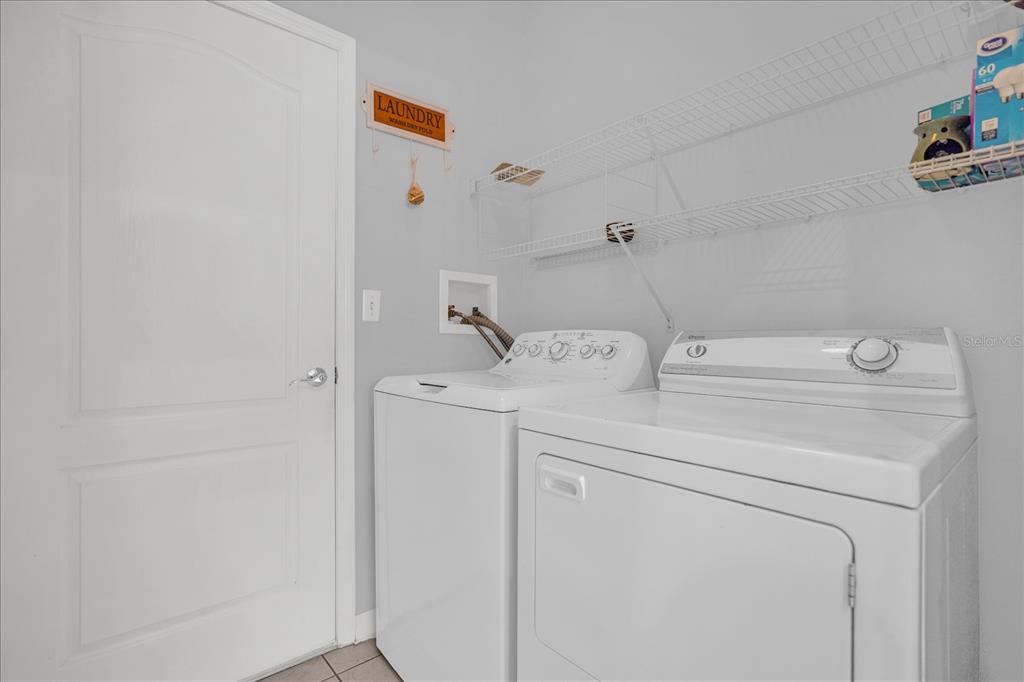 1453 Royal Ridge Drive Davenport, FL 33896 - Photo 24 of 32 a utility room with dryer and washer