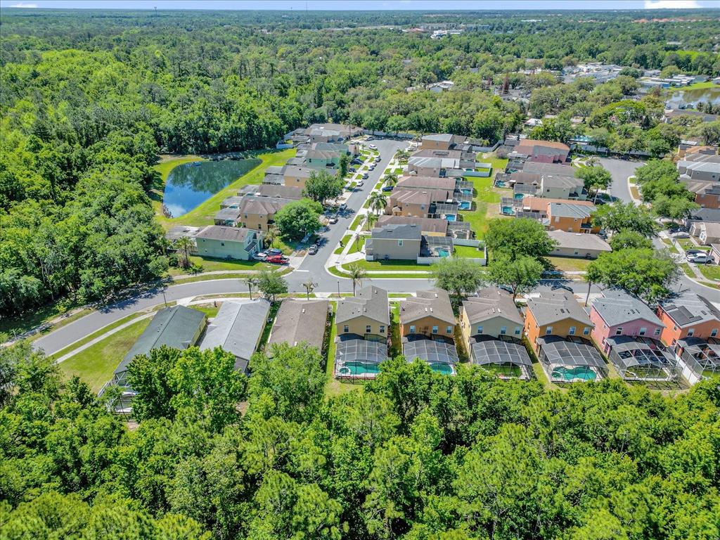 1453 Royal Ridge Drive Davenport, FL 33896 - Photo 29 of 32 an aerial view of a house with a garden and lake view