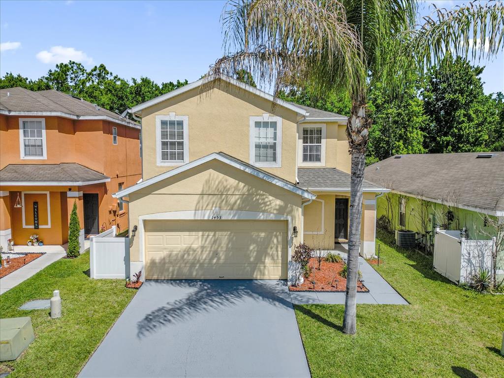 1453 Royal Ridge Drive Davenport, FL 33896 - Photo 32 of 32 a front view of a house with a yard