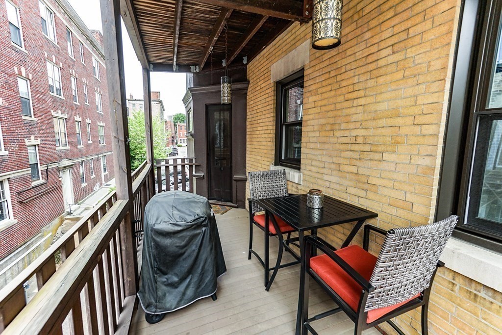 17 Park Vale, Unit 4 Brookline, MA 02446 - Photo 20 of 24 a view of a balcony with furniture and next to a window