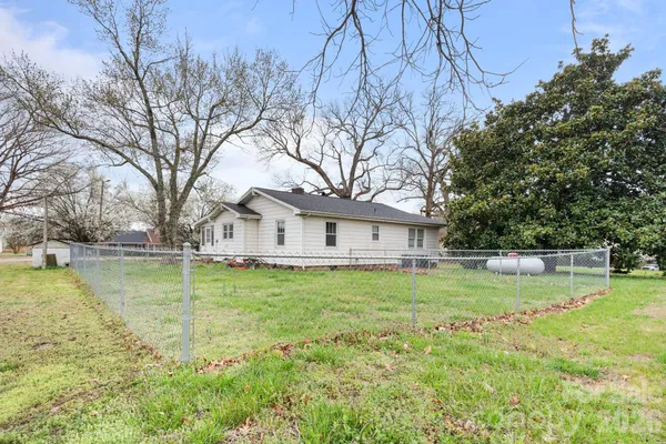 a view of outdoor space with green field and trees