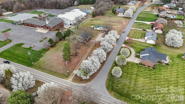 an aerial view of a house with a swimming pool