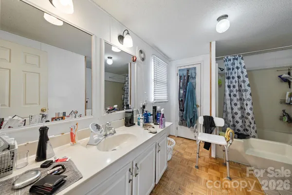 a bedroom with two beds and a dresser