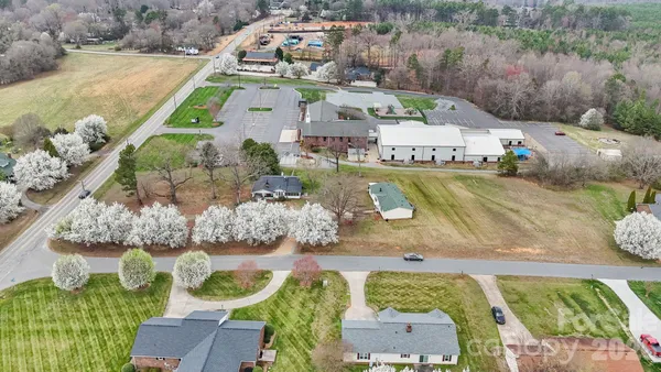 an aerial view of a house with outdoor space