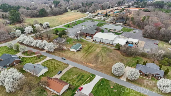 an aerial view of a house with outdoor space